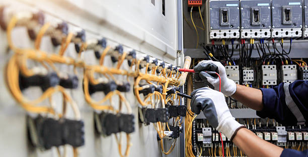 Professional Electrician technician working in Penn State Erie, PA